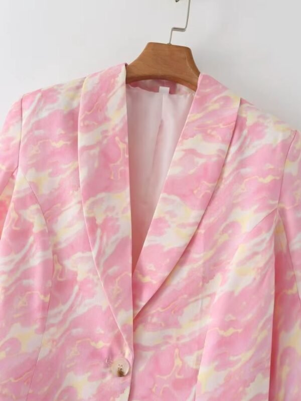 collar of pink colorful blazer on a hanger