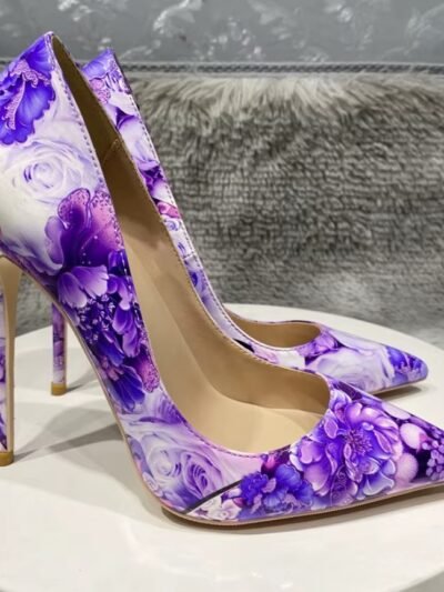 right side of purple floral heels on a white stool