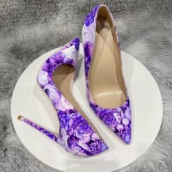 purple floral heels lying on a white stool
