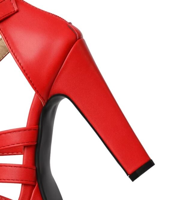 heel of red high heel sandals on the white background