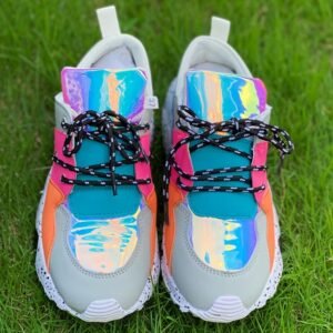 front view of sporty colorful sneakers on the grass