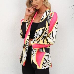 blonde woman wearing stylish colorful blazer and black pants