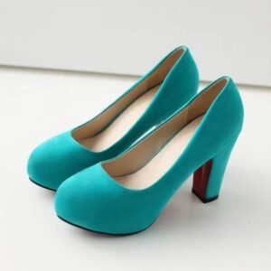 side view of turquoise heels on the white floor