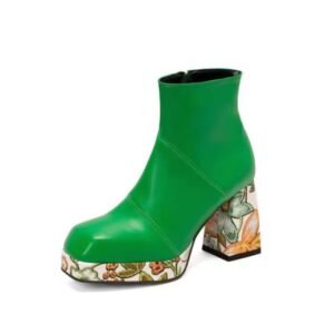 green colorful Chelsea boots on the white background