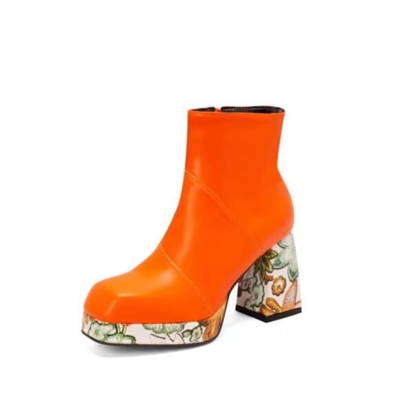 orange Chelsea boots on the white background