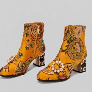 yellow colorful embroidery boots on the grey background