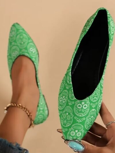 woman wearing one of colorful flats for women and holding the other one