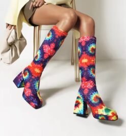 woman wearing colorful high heel boots and beige blazer with brown elegant shorts