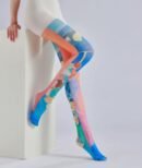 woman wearing colorful oil painting and sitting on a white elevation