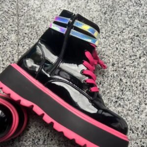 side view of colorful punk boots on the grey background