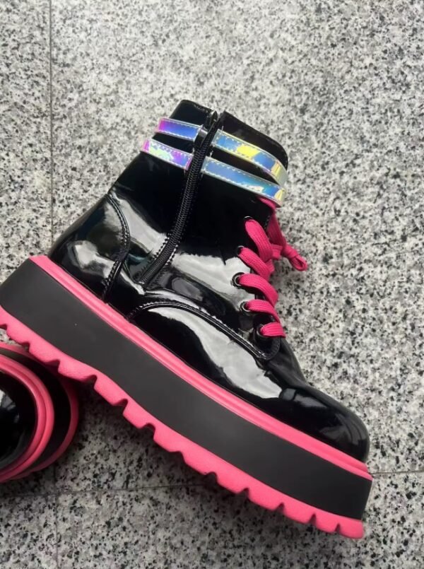 side view of colorful punk boots on the grey background