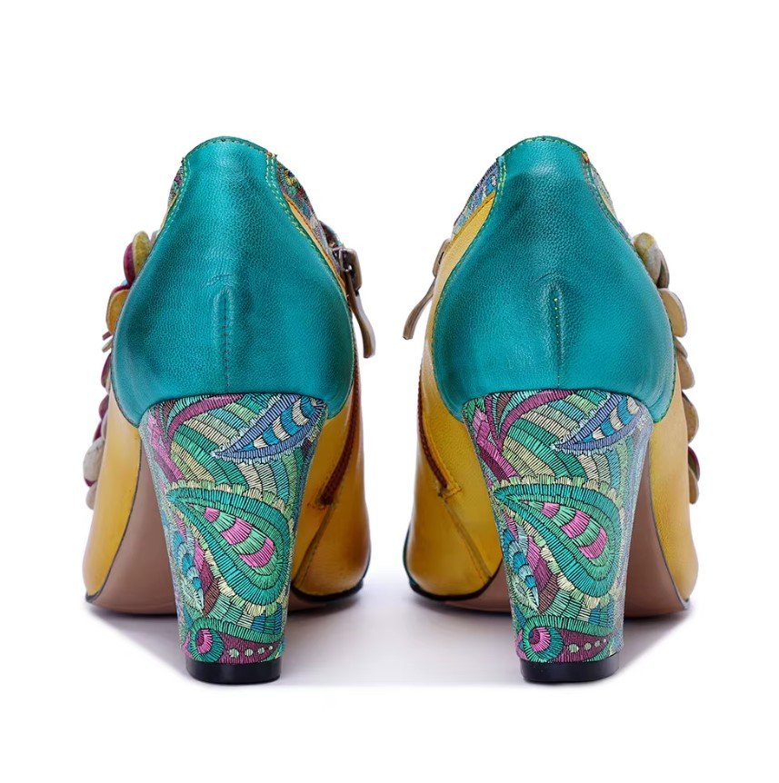 back view of colorful vintage boots on the white background