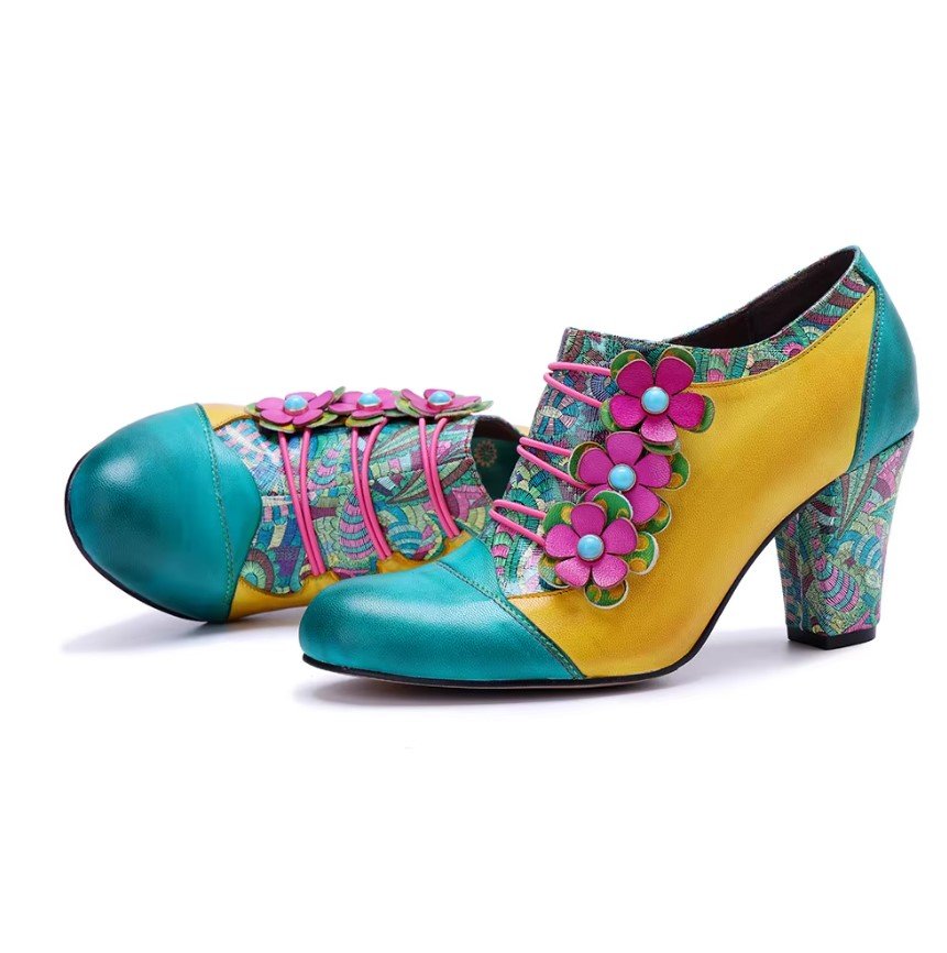 front and side view of colorful vintage boots on the white background