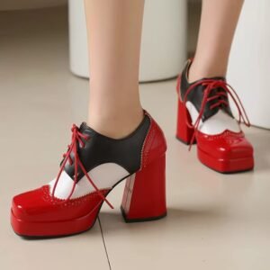 woman wearing red elegant colorful boots on the beige floor