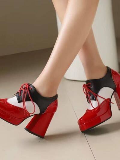 woman wearing red elegant colorful boots in the beige room