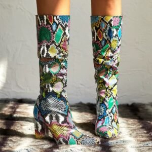 woman standing in mid-calf colorful boots on the grey background