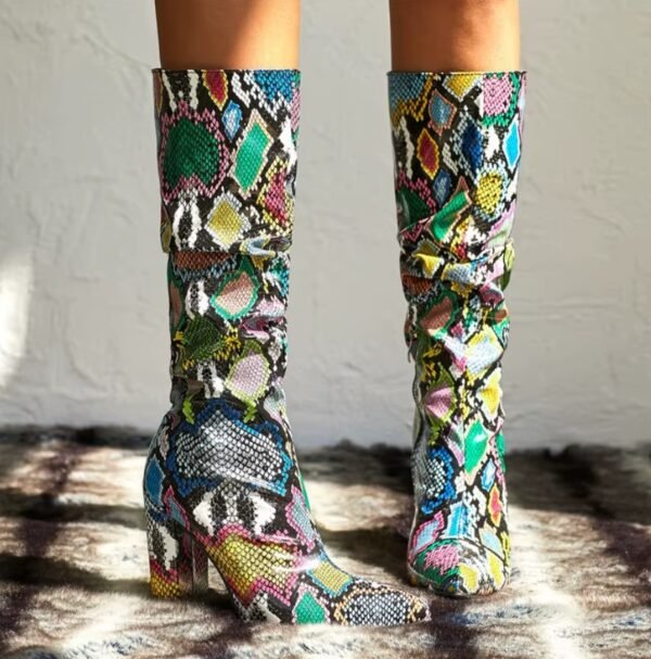 woman standing in mid-calf colorful boots on the grey background