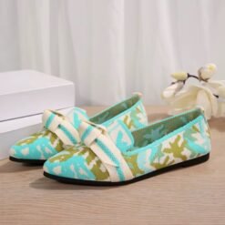 side view of multi colored loafers on the floor