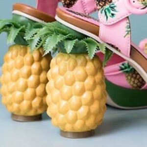 pineapple heels of pineapple sandals on the blue background