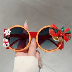 woman holding colorful Christmas sunglasses