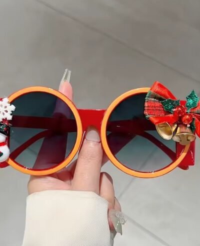 woman holding colorful Christmas sunglasses