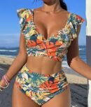 woman wearing colorful bikini with jungle print, the beach in the background