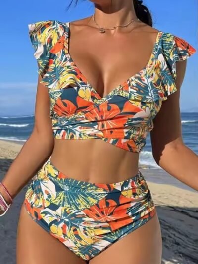 woman wearing colorful bikini with jungle print, the beach in the background