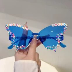 woman holding blue variation of colorful Birthday sunglasses