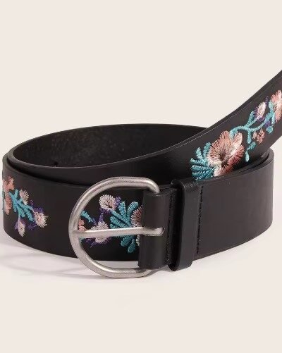 colorful embroidery belt on the beige background