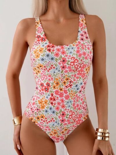 woman wearing colorful floral one piece swimsuit