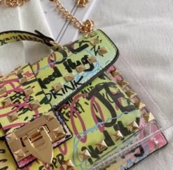 material and golden closure of colorful graffiti bag