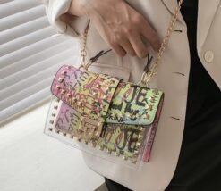 woman wearing colorful graffiti bag with a beige blazer