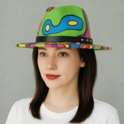 woman wearing colorful hat and a white top