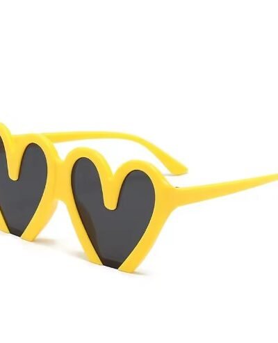 yellow variation of colorful heart shaped sunglasses on the white background