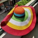 colorful striped hat lying on a beige surface