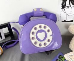 purple colorful telephone bag lying on a grey desk