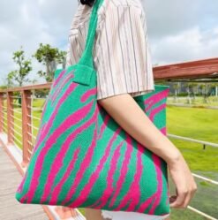 woman wearing green and pink variation of colorful tote bag