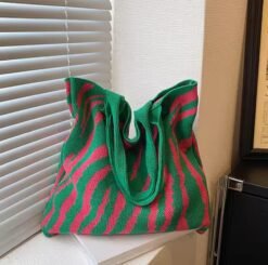 back view of colorful tote bag next to the white window