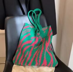 colorful tote bag on the black leather chair