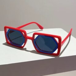 side view of designer colorful sunglasses on a white surface