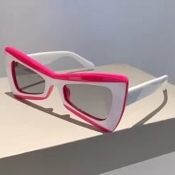 side view of modern colorful sunglasses on a white surface