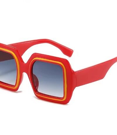 side view of oversized colorful sunglasses on the white background