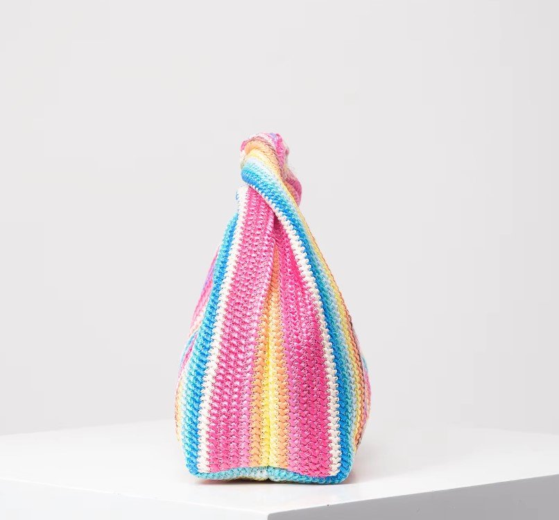 side view of vintage colorful bag on the white background