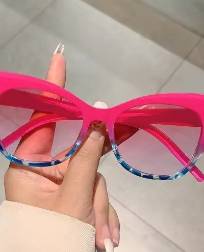 woman holding women's colorful sunglasses