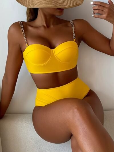 woman wearing yellow bikini and crossing her legs