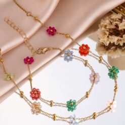 colorful flowers jewelry set arranged on a silky fabric