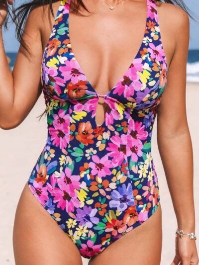 woman wearing colorful one piece swimsuit for women on the beach