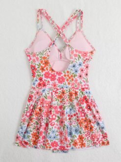 back view of colorful one piece swimsuit with a skirt on the white background