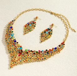 side view of colorful rhinestone jewelry set on the beige background
