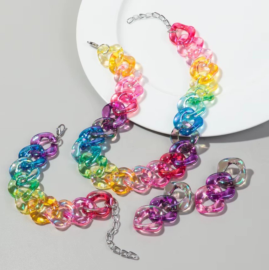 statement jewelry set arranged on a grey and white surface